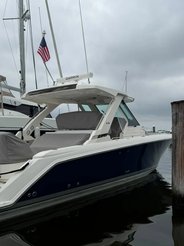 Tiara center console tied up at the dock after a detail